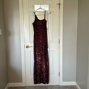 Originally from Von Maur. Size 7. One shoulder and Slit. Color- Maroon.